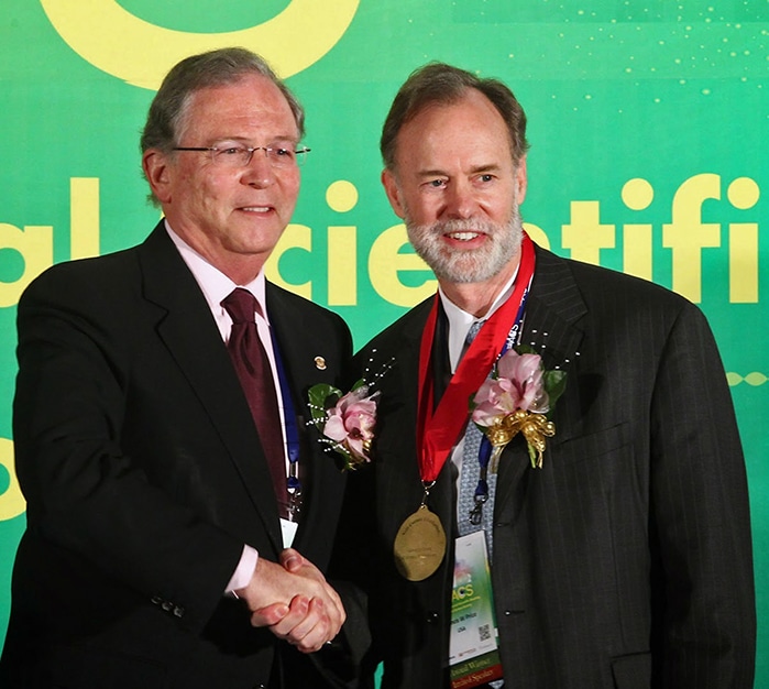 Dr. Price receiving the 2014 Asia Cornea Foundation award