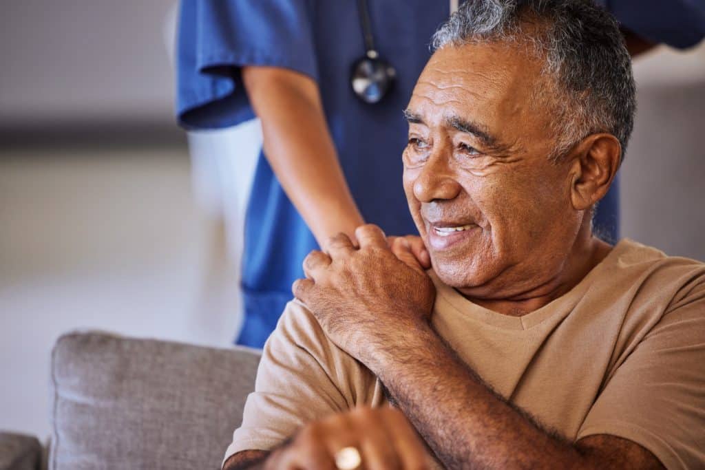 Happy senior man talking with a doctor