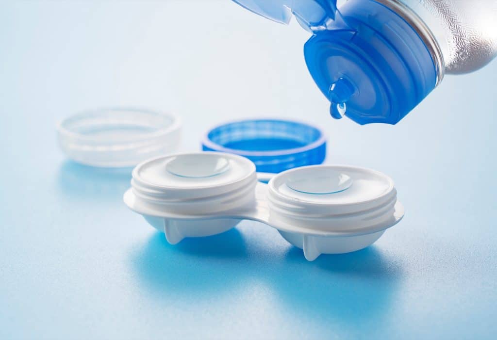 Contact lens case and solution