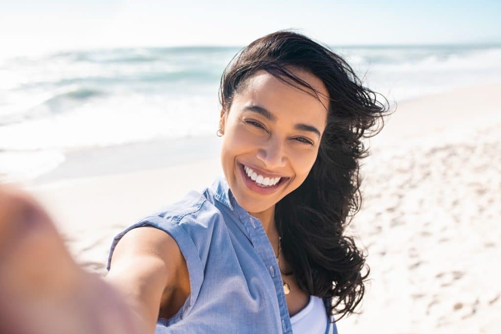 Smiling woman at the beach