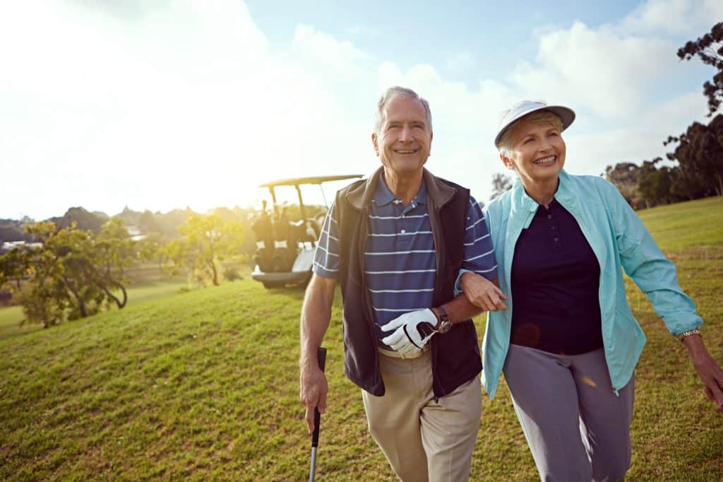 Senior couple enjoying a round of golf