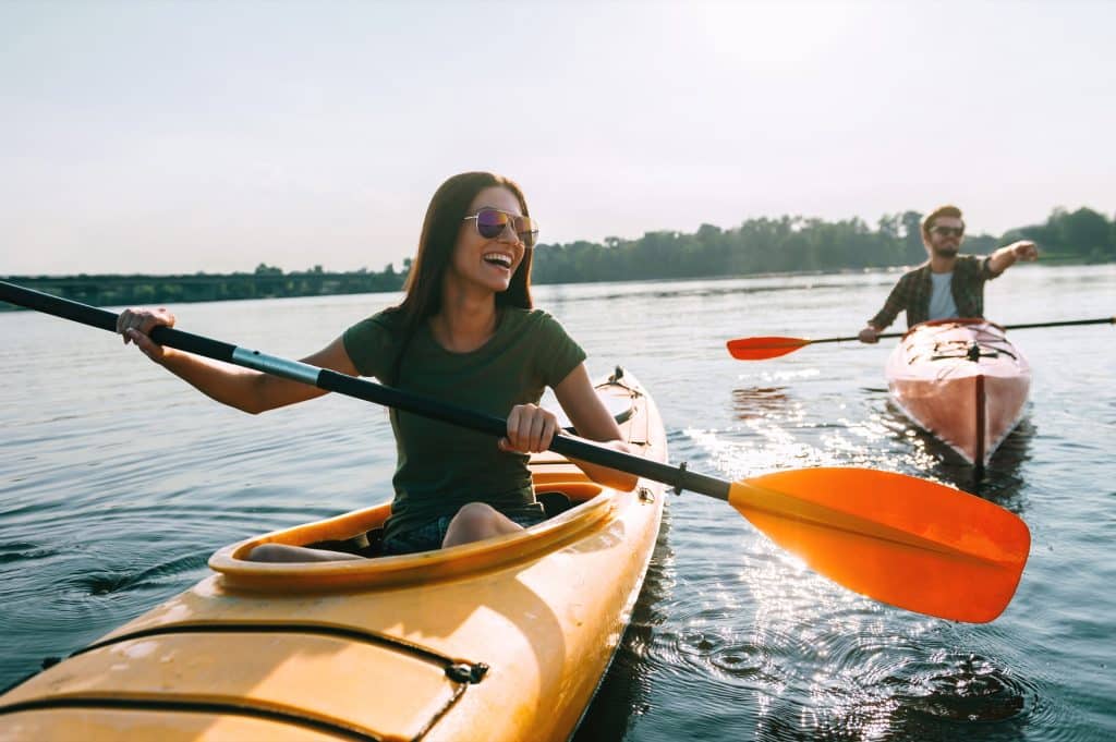 Woman kayaking on a lake