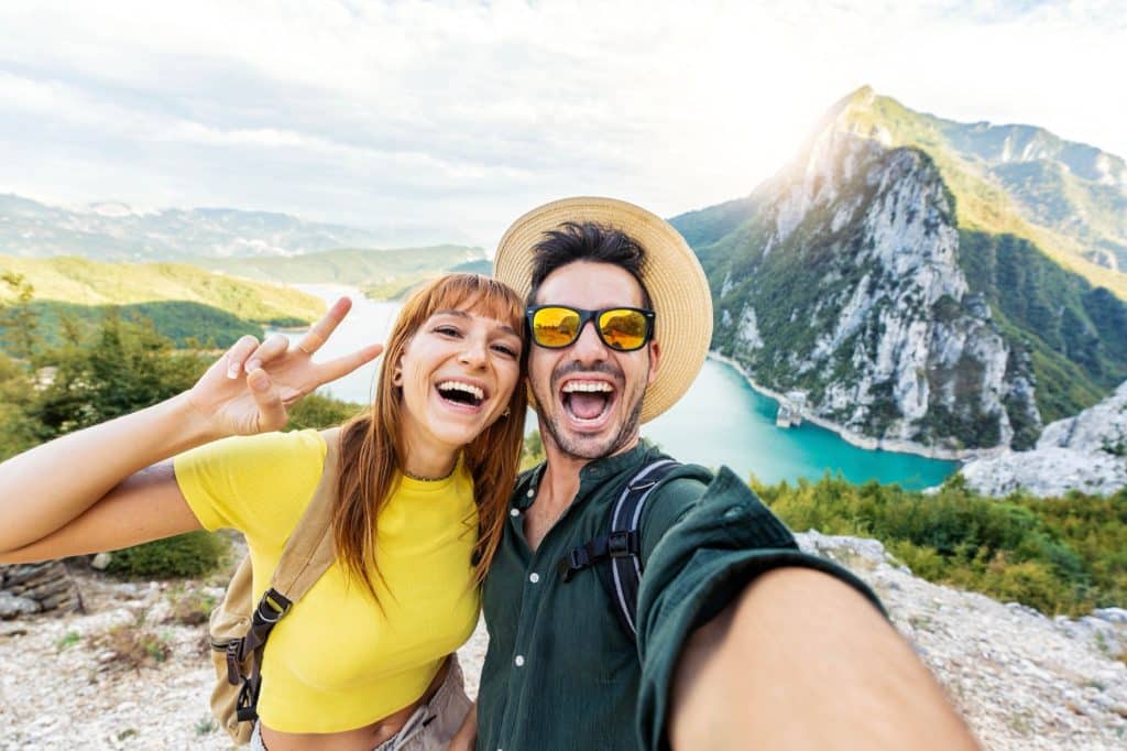 Couple taking a selfie on a mountain trip