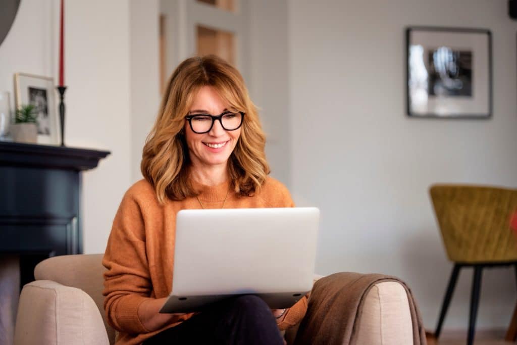 Woman working on a laptop at home