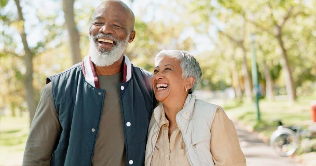 Senior couple laughing in a park