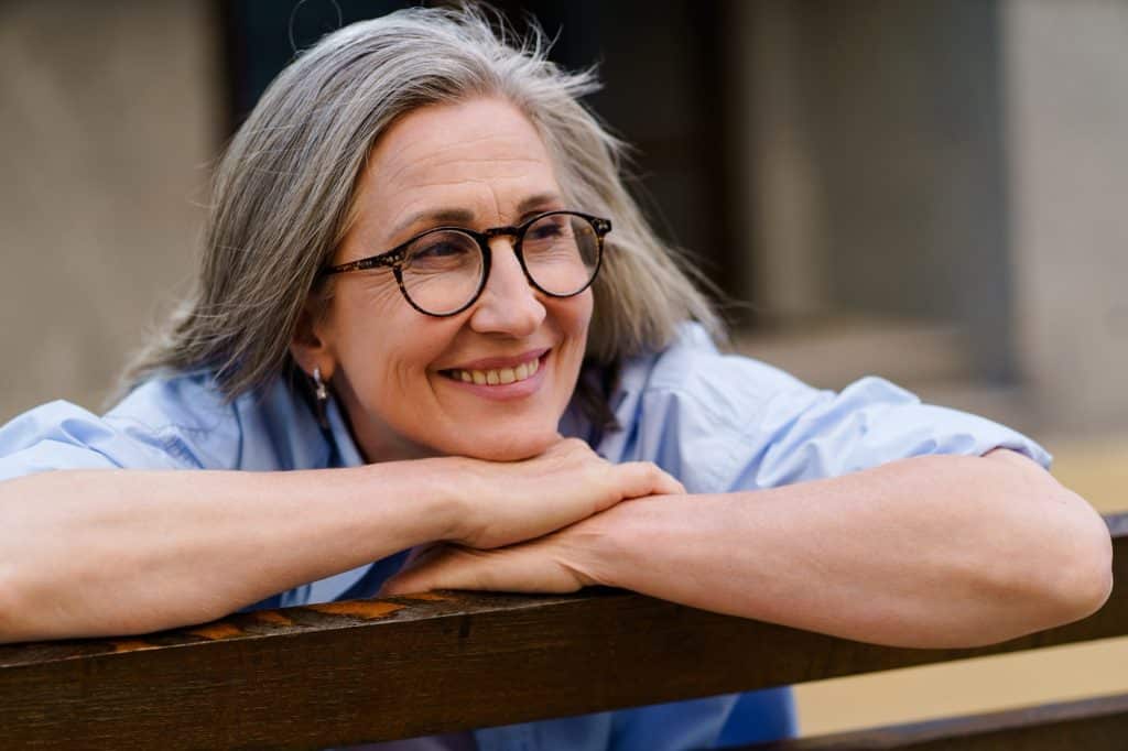 Smiling senior woman wearing glasses
